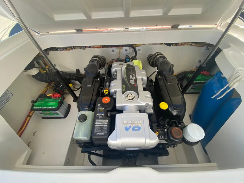 Slide: The Image of 2019 Baja 24 Outlaw engine compartment with powerful V8 engine and dual batteries. - 24