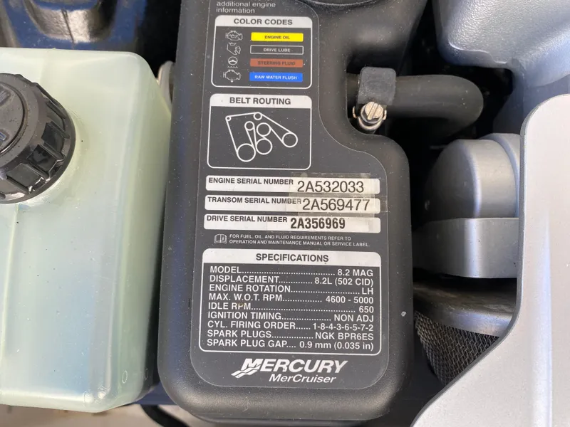 Slide: The Image of Mercury MerCruiser engine specifications label on a 2019 Baja 24 Outlaw boat. - 25