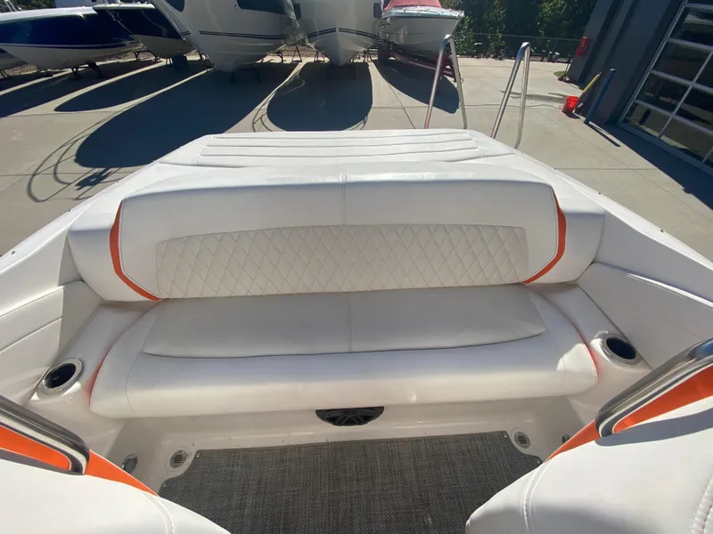 Slide: The Image of 2019 Baja 24 Outlaw boat interior with white and orange seating. - 9