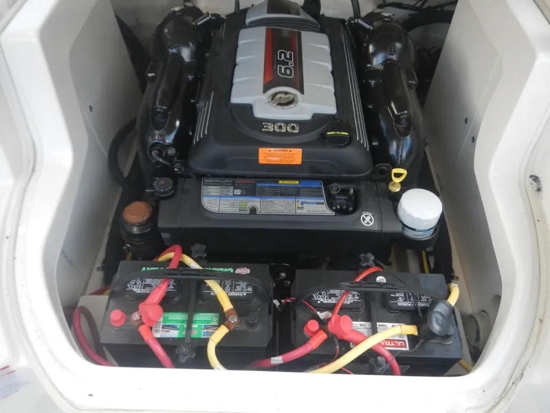 Slide: The Image of Engine compartment of 2020 Chaparral 24 SSI boat with dual batteries and 300 HP engine. - 14
