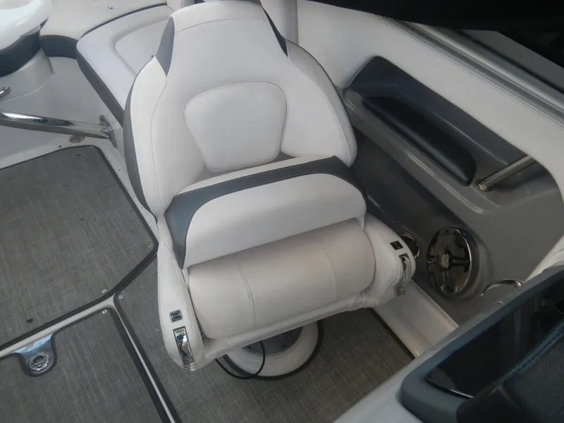 Slide: The Image of 2020 Chaparral 24 SSI boat interior with plush seating and modern design. - 7