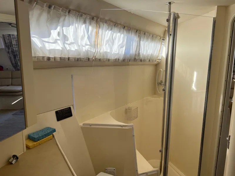 Slide: The Image of Bathroom interior of 1997 Carver 380 Santego SE yacht with shower and curtain. - 18