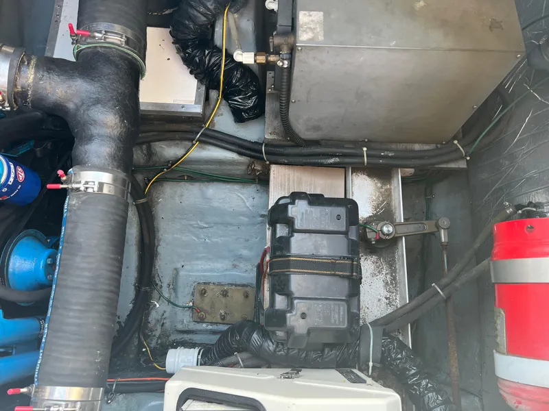 Slide: The Image of Engine compartment of a 1997 Carver 380 Santego SE with visible components and wiring. - 24