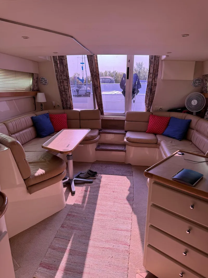 Slide: The Image of Interior of 1997 Carver 380 Santego SE yacht with spacious seating and table. - 43