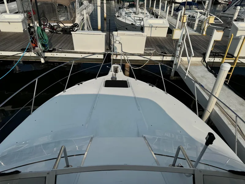 Slide: The Image of 1997 Carver 380 Santego SE yacht docked at marina, top view. - 5