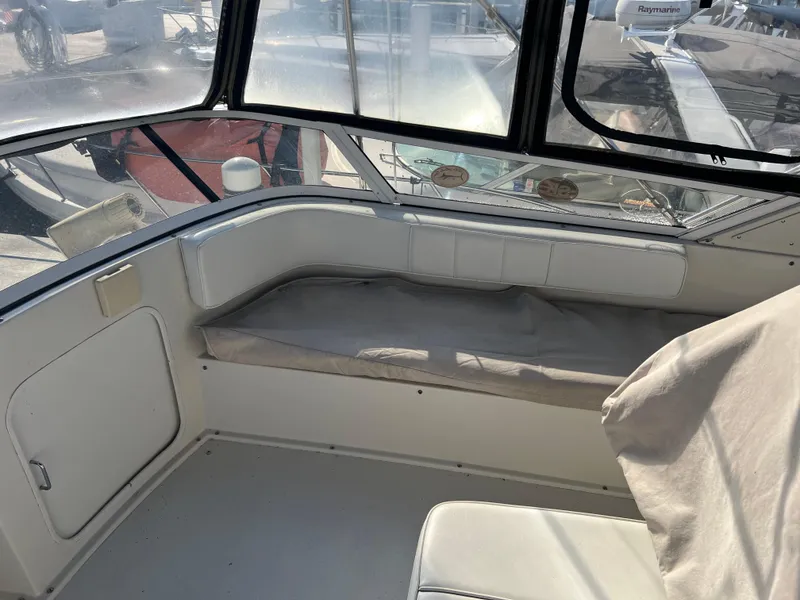 Slide: The Image of Interior view of 1997 Carver 380 Santego SE boat with cushioned seating. - 10