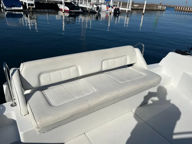 Slide: The Image of White seating on 1997 Carver 380 Santego SE boat at marina. - 14