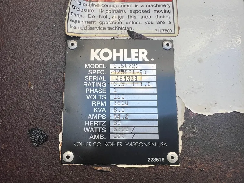 Slide: The Image of Kohler generator specification plate on a 1997 Carver 380 Santego SE boat. - 28