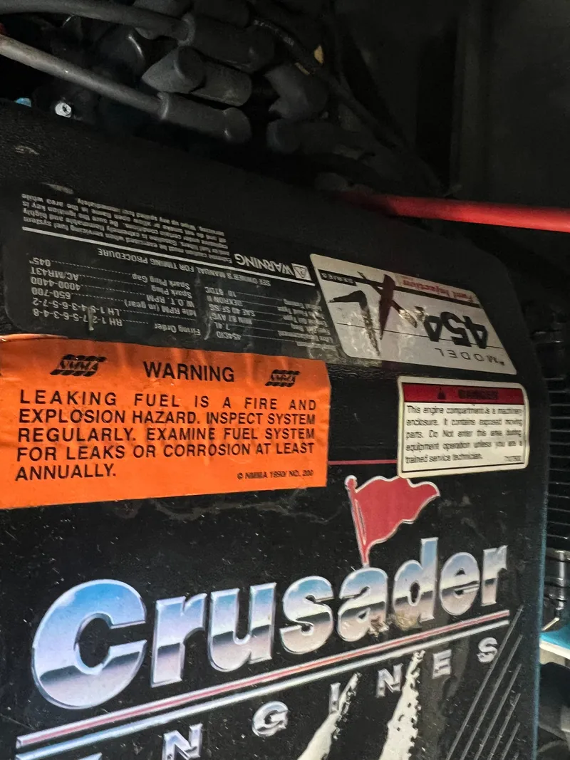 Slide: The Image of Crusader engine warning labels on a 1997 Carver 380 Santego SE boat. - 29