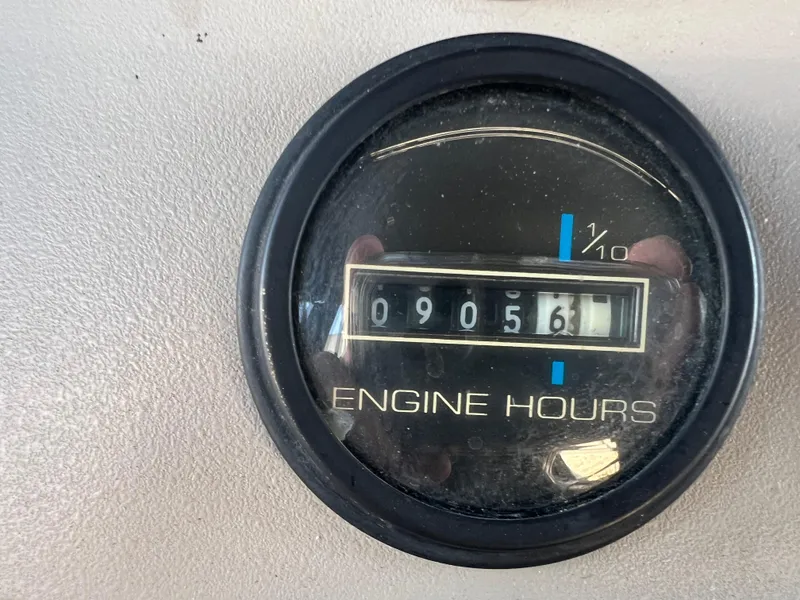 Slide: The Image of Engine hours gauge showing 9056 hours on 1997 Carver 380 Santego SE. - 31