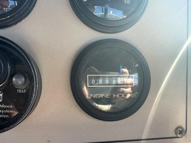 Slide: The Image of Close-up of 1997 Carver 380 Santego SE engine hours gauge showing 898.9 hours. - 32