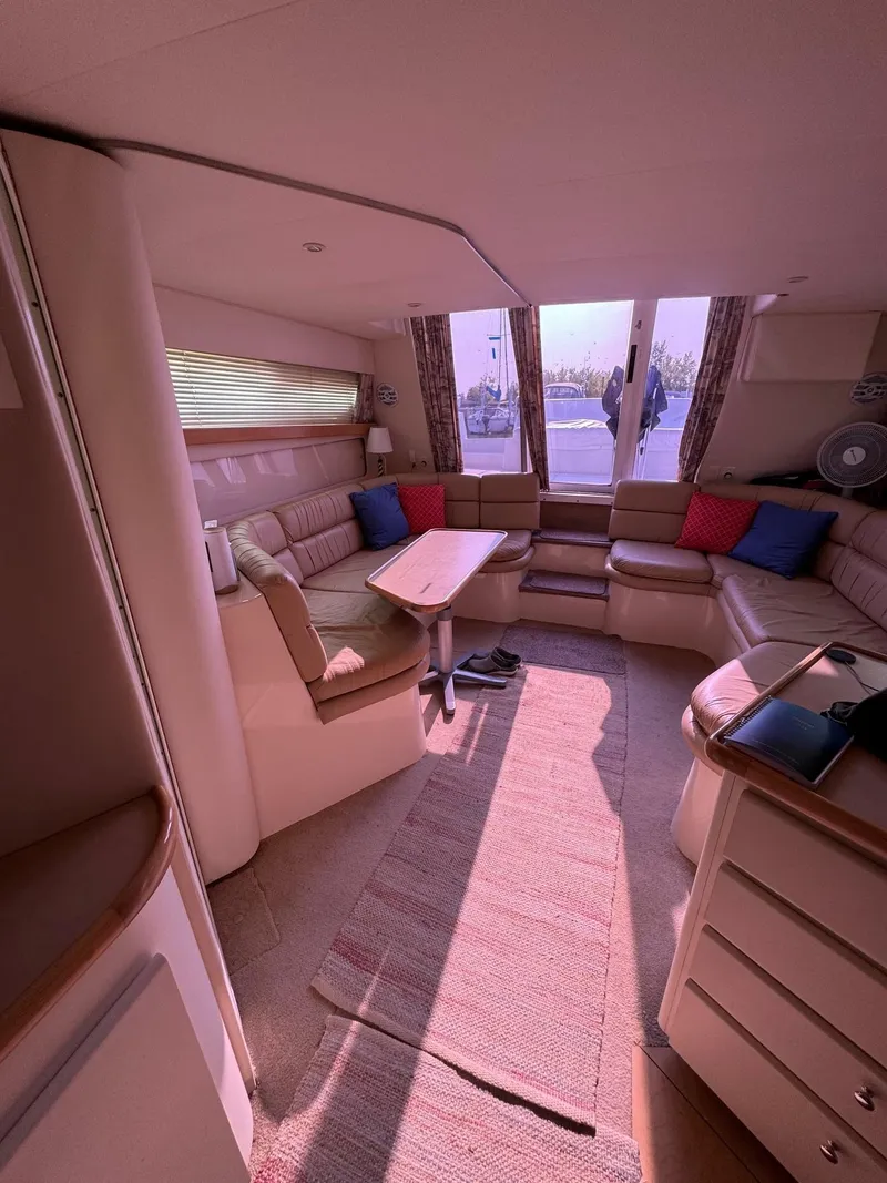 Slide: The Image of Interior of 1997 Carver 380 Santego SE yacht with cozy seating and table. - 38