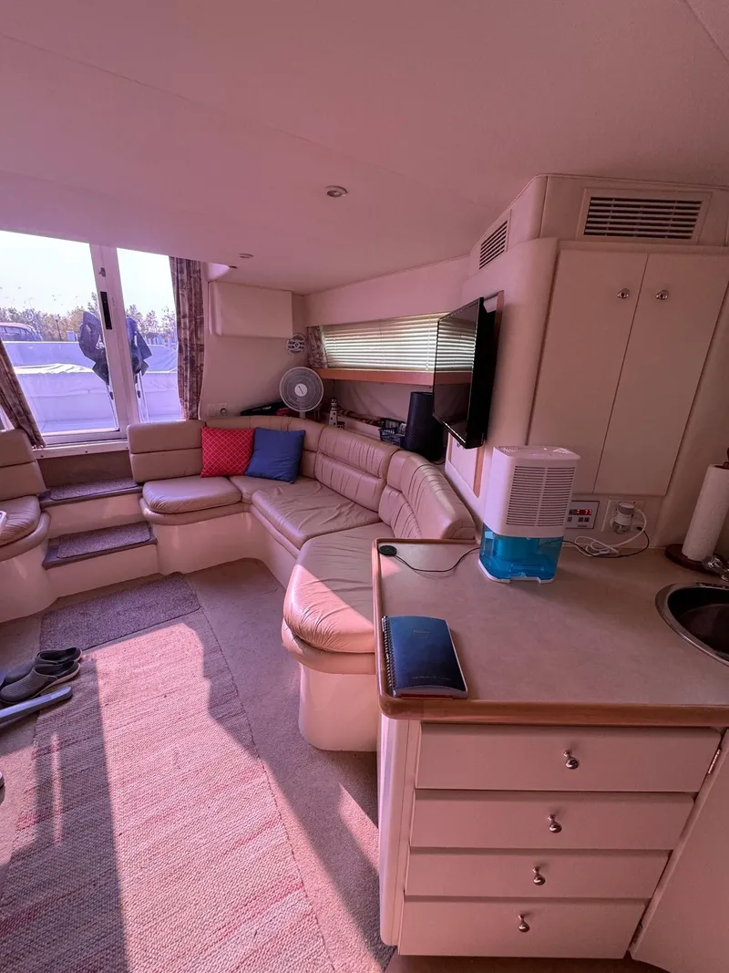 Slide: The Image of Interior of 1997 Carver 380 Santego SE yacht with cozy seating and kitchenette. - 39