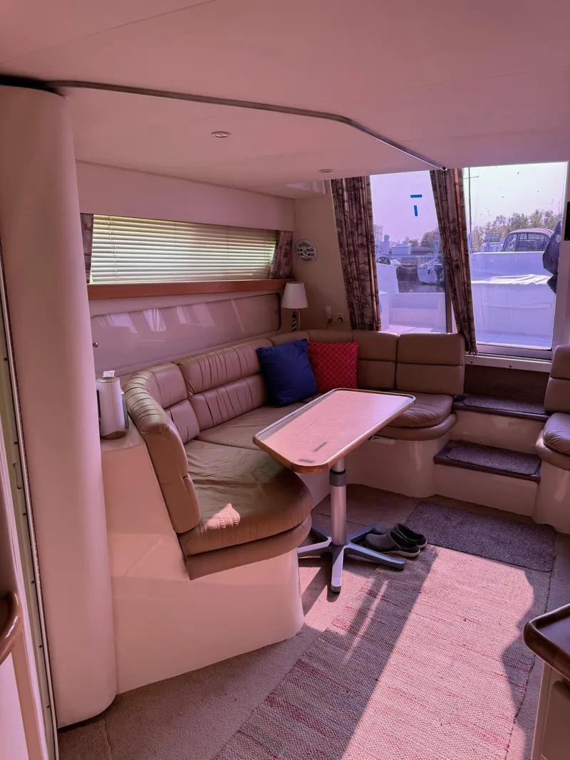 Slide: The Image of Interior of 1997 Carver 380 Santego SE yacht with cozy seating and table. - 44