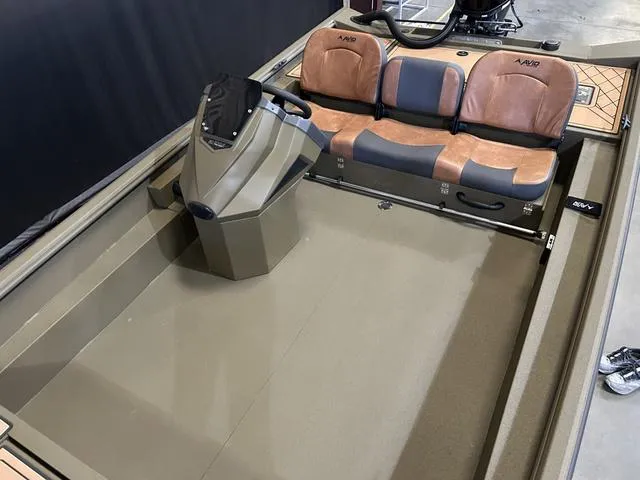 Slide: The Image of 2025 Avid 18 SC Rogue boat interior with Yamaha 90 "SHO" engine, featuring brown seating. - 10