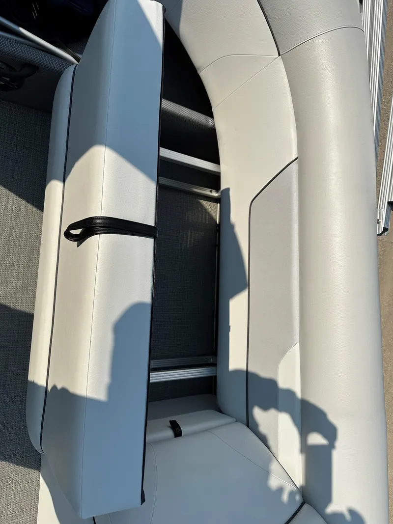 Slide: The Image of 2022 Crest Classic DLX 220 boat seat with storage compartment open. - 15