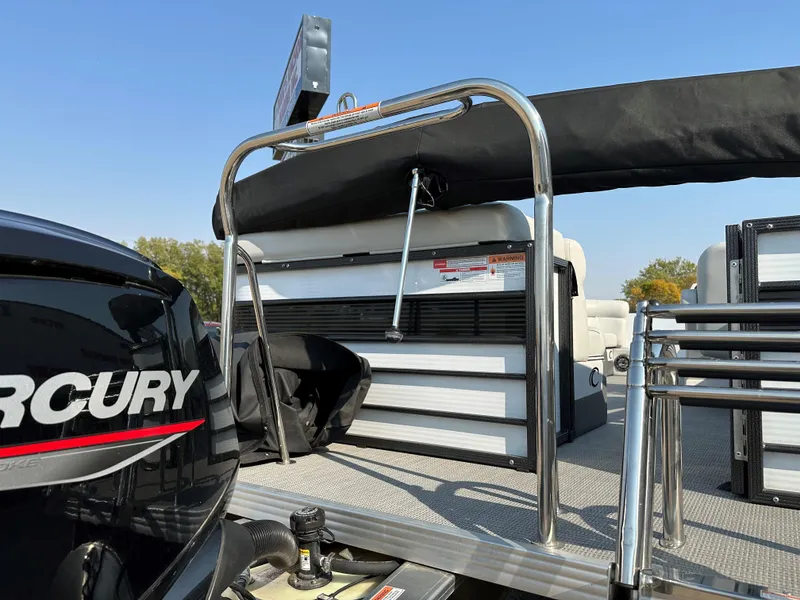 Slide: The Image of 2022 Crest Classic DLX 220 pontoon boat with Mercury engine, rear view. - 20