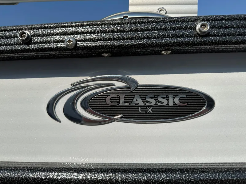 Slide: The Image of 2022 Crest Classic DLX 220 logo on boat exterior. - 4