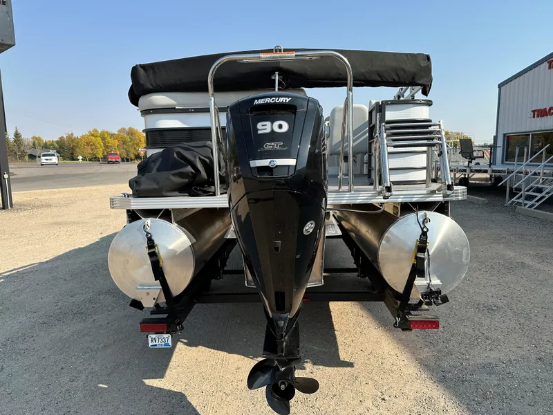 Slide: The Image of 2022 Crest Classic DLX 220 pontoon boat with Mercury 90 HP engine, rear view. - 5