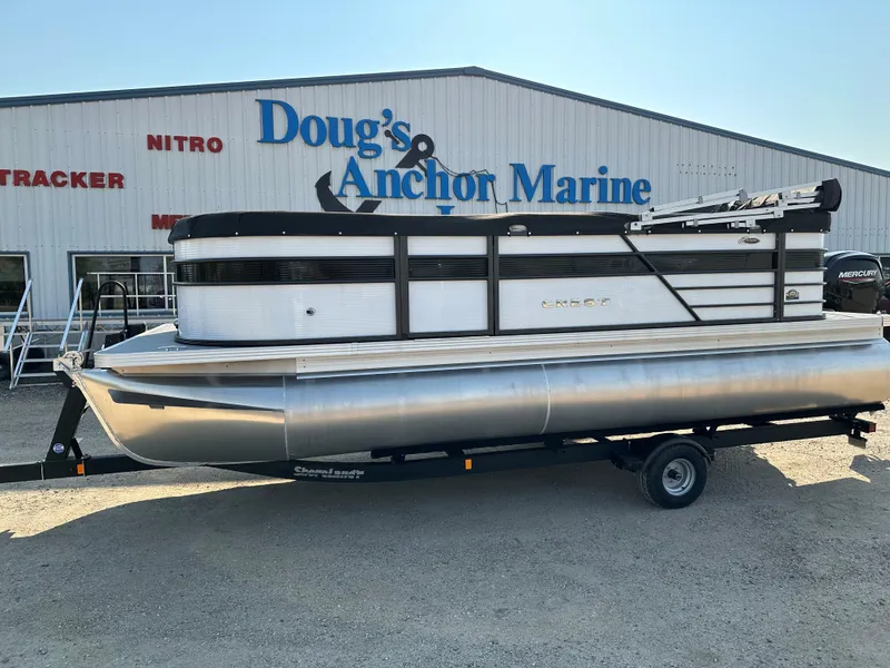 Slide: The Image of 2022 Crest Classic DLX 220 pontoon boat on trailer at Doug's Anchor Marine. - 6