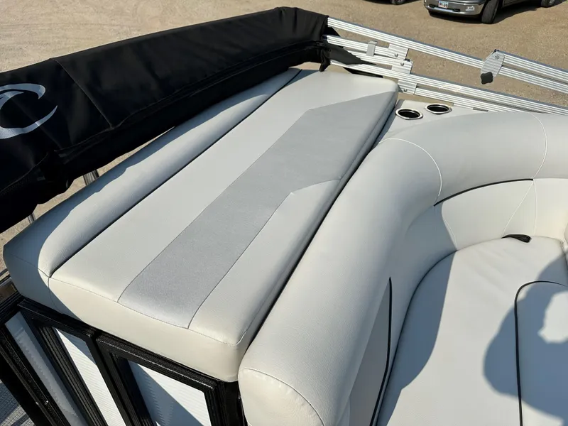 Slide: The Image of 2022 Crest Classic DLX 220 boat with plush seating and cup holders. - 8