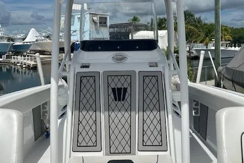 Slide: The Image of 2022 Wellcraft 222 Fisherman boat at marina, featuring sleek design and modern console. - 7