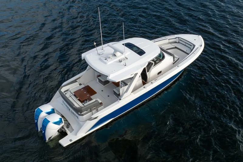 The Image of 2020 Tiara Sport 38 LS boat on open water, aerial view. - 0