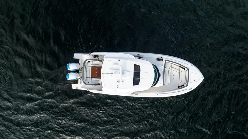 Slide: The Image of Aerial view of 2020 Tiara Sport 38 LS boat on dark water. - 13