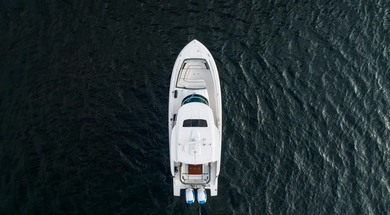 Slide: The Image of Aerial view of 2020 Tiara Sport 38 LS yacht on dark water. - 14