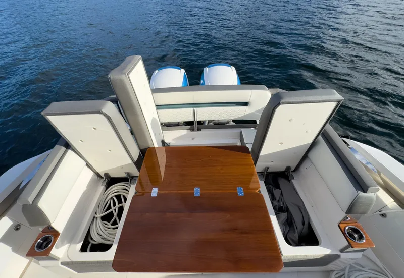 Slide: The Image of 2020 Tiara Sport 38 LS boat with seating and table on deck. - 20