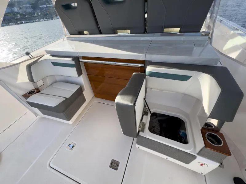 Slide: The Image of 2020 Tiara Sport 38 LS boat interior with seating and storage compartments. - 26