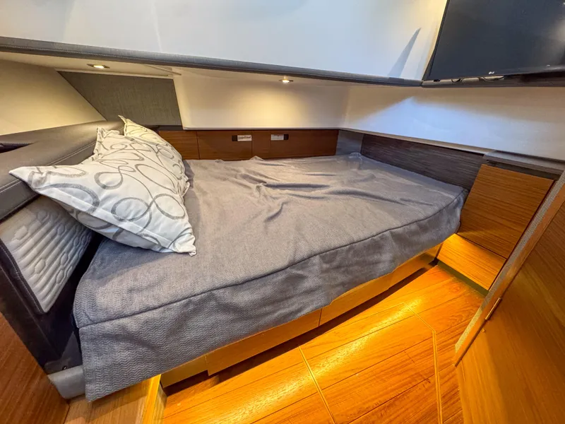 Slide: The Image of 2020 Tiara Sport 38 LS cabin interior with cozy bed and modern design. - 36