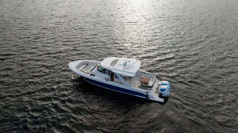 Slide: The Image of Tiara Sport 38 LS 2020 boat cruising on open water. - 6