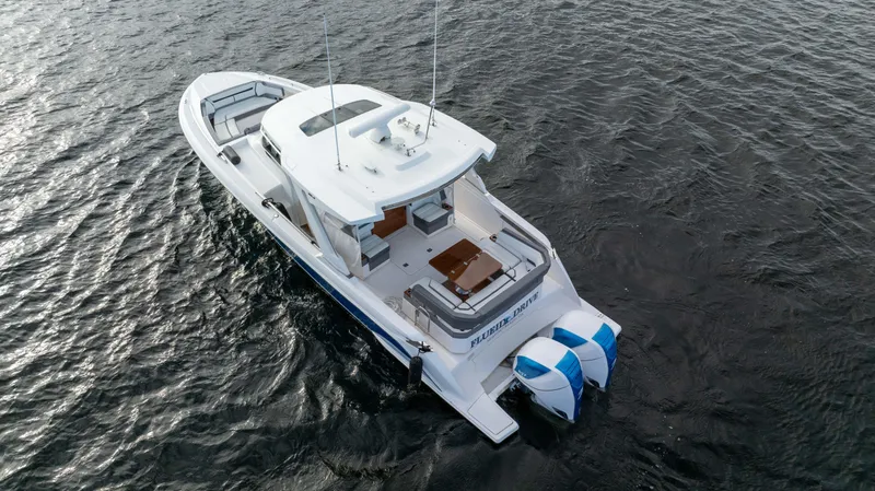 Slide: The Image of 2020 Tiara Sport 38 LS boat on water, aerial view. - 7