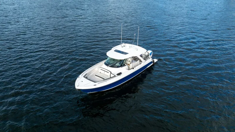 Slide: The Image of 2020 Tiara Sport 38 LS boat on open water. - 8