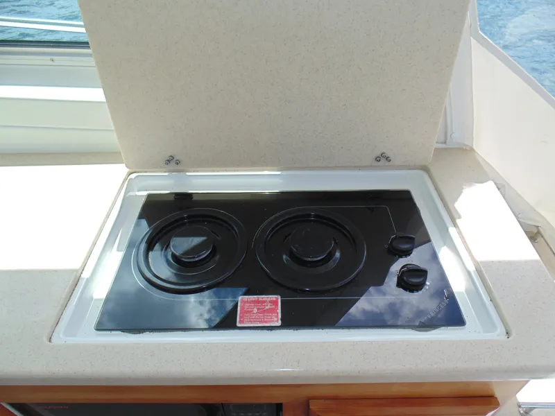 Slide: The Image of Stovetop in 2008 Back Cove 33 yacht kitchen area. - 10
