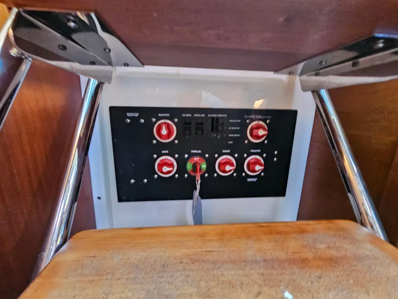 Slide: The Image of Control panel of a 2008 Back Cove 33 boat with switches and dials. - 27