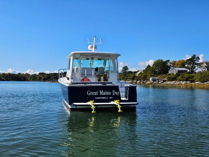 Slide: The Image of 2008 Back Cove 33 boat named "Great Maine Day" on calm water, Harpswell, ME. - 3