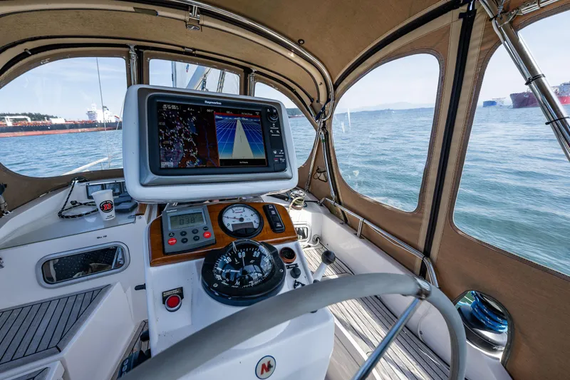 Slide: The Image of Nauticat 35 Pilot House 2000 interior with navigation equipment and sea view. - 10