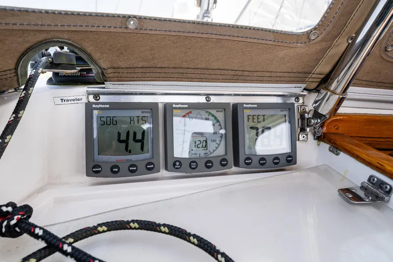 Slide: The Image of Nauticat 35 Pilot House 2000 boat instruments displaying speed, depth, and navigation data. - 14