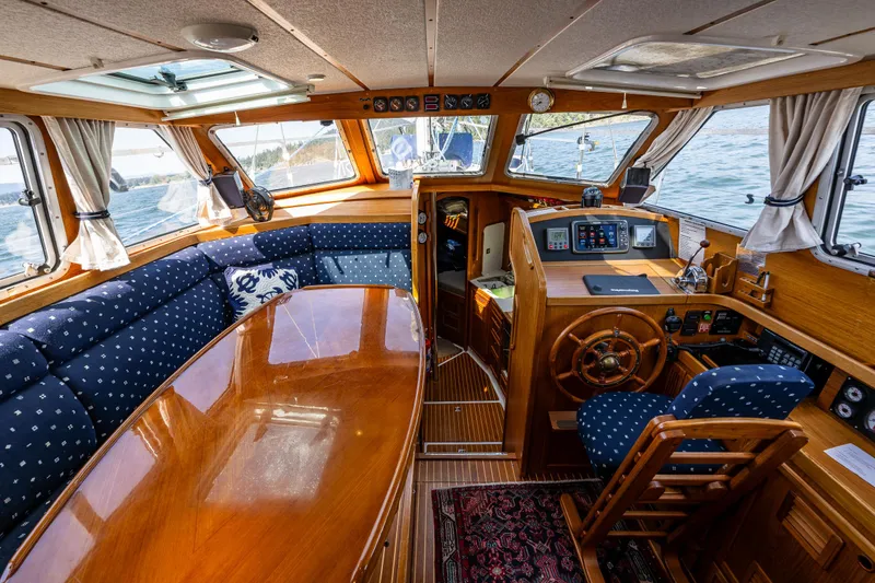 Slide: The Image of Nauticat 35 Pilot House 2000 interior with wooden finish and nautical decor. - 16