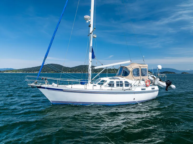Slide: The Image of Sailboat Nauticat 35 Pilot House 2000 on open water under clear blue sky. - 2