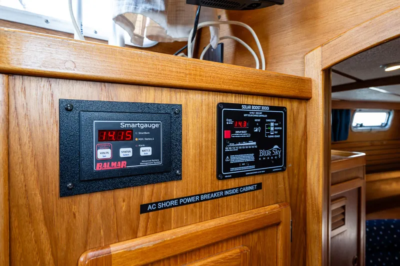 Slide: The Image of Control panel inside 2000 Nauticat 35 Pilot House, featuring Smartgauge and Blue Sky displays. - 21