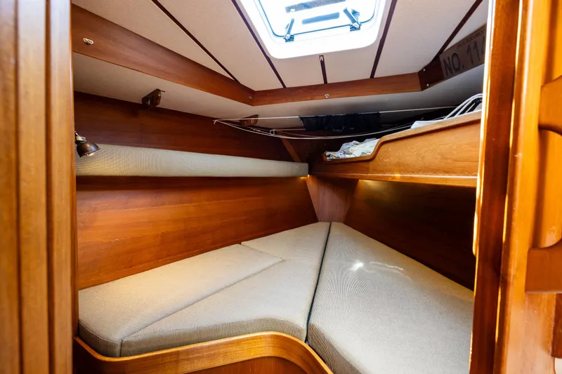 Slide: The Image of Cozy cabin interior of 2000 Nauticat 35 Pilot House with wooden finish and skylight. - 31