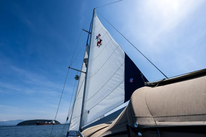 Slide: The Image of Sailing on a 2000 Nauticat 35 Pilot House under clear blue skies. - 5