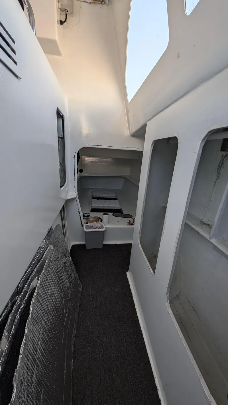 Slide: The Image of Interior view of 2019 Kelsall 38ma catamaran with modern design and spacious layout. - 10
