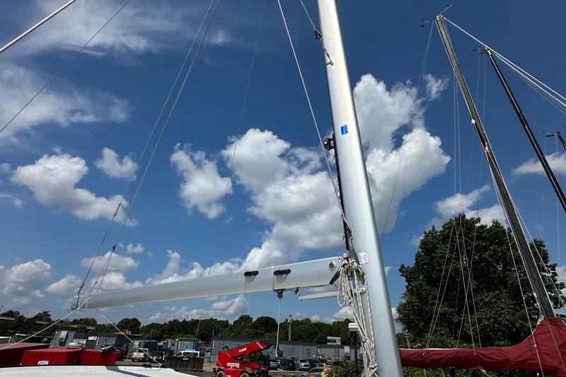Slide: The Image of Sailboat mast and rigging of 2019 Kelsall 38ma under a clear blue sky. - 22