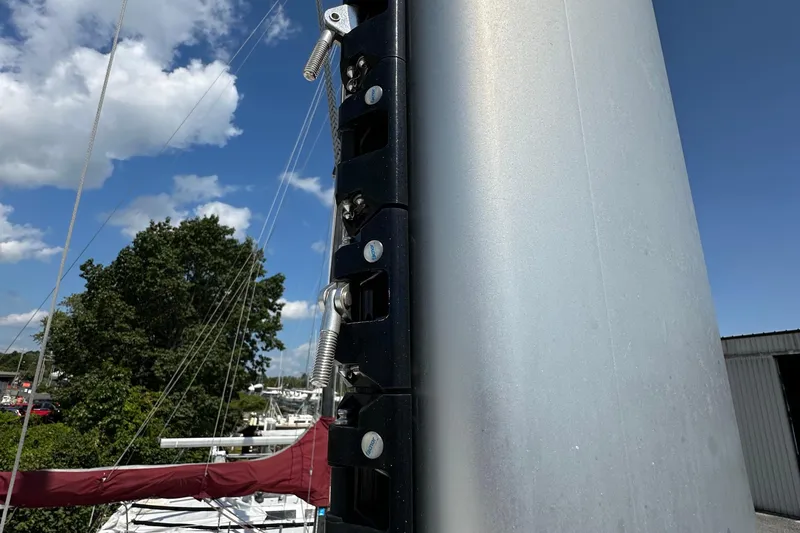 Slide: The Image of Close-up of a 2019 Kelsall 38ma sailboat mast with rigging against a blue sky. - 24