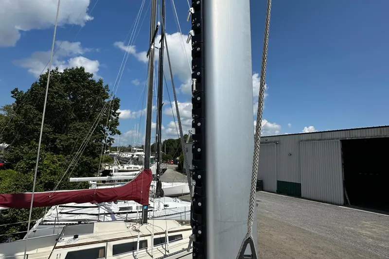 Slide: The Image of Sailboat mast and rigging at marina, Kelsall 38ma, 2019 model, clear blue sky. - 27