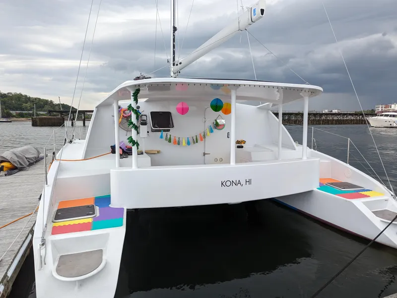 Slide: The Image of Colorful 2019 Kelsall 38ma catamaran docked, decorated with festive garlands and lanterns. - 3